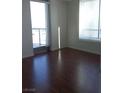 Bright bedroom with large windows and hardwood floors at 200 W Sahara Ave # 3412, Las Vegas, NV 89102