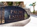 Paloma Estates community sign with lush landscaping and gated entrance at 2111 Loro Ct, Las Vegas, NV 89117