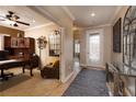 Entryway with decorative mirror, stylish rug and office with desk, hutch and chair at 2217 Merrimack Valley Ave, Henderson, NV 89044