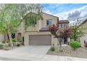 Charming two-story home with a well-manicured front yard and attached two car garage at 2617 Romarin Ter, Henderson, NV 89044