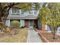Charming two-story home featuring a well-manicured lawn and walkway at 2812 Shadow Creek Cir, Las Vegas, NV 89117