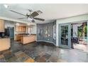 Open-concept kitchen with breakfast bar and sliding door to the backyard at 2812 Shadow Creek Cir, Las Vegas, NV 89117