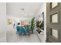 Open-concept dining room featuring modern decor and sliding glass doors at 283 Fossil Falls St, Henderson, NV 89015