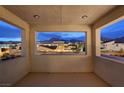 The balcony offers a beautiful view of the neighborhood and the mountains on the horizon at 472 Windstone Crest Ave, Las Vegas, NV 89138