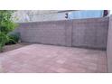 The backyard patio is paved with tile, surrounded by block walls for privacy, creating a perfect outdoor retreat at 6339 Sharp Rock Ct, Las Vegas, NV 89139