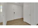 Bright entryway featuring wood-look flooring and white interior doors at 7222 Liberty Pride St, Las Vegas, NV 89148