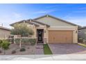 Charming single-story home featuring desert landscaping, a brick driveway, and a two-car garage at 732 Rosewater Dr, Henderson, NV 89011