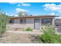 Inviting single-story home showcasing desert landscaping and a secure fenced yard at 916 Putnam Ave, North Las Vegas, NV 89030