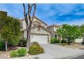 A charming two-story house with well-maintained landscaping is nestled in a quiet neighborhood at 9264 Ansley Ct, Las Vegas, NV 89148