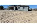 Unfinished single-story home exterior featuring block construction and an expansive lot at 970 Mount Charleston Dr, Pahrump, NV 89048