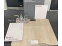 Upgraded bath finishings include vinyl plank, quartz countertop, and stylish chrome faucets at 9989 River Corral St, Las Vegas, NV 89166
