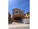 New construction showing the house framing, showcasing modern design and large window openings under a clear blue sky at 9989 River Corral St, Las Vegas, NV 89166