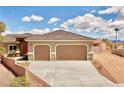 Attractive home featuring a spacious driveway, two-car garage, and neat front yard at 1931 Rose Ct, Pahrump, NV 89048
