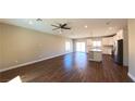 Spacious living room showcasing hardwood floors, recessed lighting, and an open floor plan to the kitchen at 1931 Rose Ct, Pahrump, NV 89048