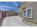 Spacious driveway leading to a detached garage with ample parking and private access at 2641 Vendange Pl, Henderson, NV 89044