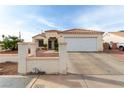 Inviting single-story home with a private driveway and desert landscaping in front at 436 Pumpkin Way, Henderson, NV 89015