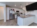 Modern kitchen featuring stainless steel appliances, granite countertops, and ample storage space at 6804 Surf Green Ct, North Las Vegas, NV 89086