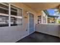 A view of the entryway with a security door and windows providing natural light to the interior at 8410 Eldora Ave # 2045, Las Vegas, NV 89117