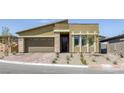 Inviting single-story home features a two-car garage and low-maintenance desert landscaping at 12438 Heritage Bend Dr, Las Vegas, NV 89138