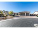 Charming home exterior with a well-manicured lawn, three-car garage, and inviting curb appeal at 8637 Home Gate Ct, Las Vegas, NV 89113