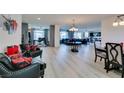 Spacious open-concept living room with hardwood floors, stylish furnishings, and abundant natural light at 8637 Home Gate Ct, Las Vegas, NV 89113