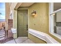 A welcoming front door entrance, exterior lighting, and attractive neutral exterior paint at 1024 Coatbridge St, Las Vegas, NV 89145