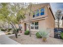 Charming home showcasing neutral siding, a tile roof, and a well-maintained, landscaped front yard at 11036 Mount Hunter St, Las Vegas, NV 89179