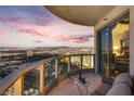 Condo balcony with cityscape views, seating area, and sliding glass doors at 322 Karen Ave # 4207, Las Vegas, NV 89109