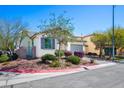 Cozy home with a well-maintained yard, charming desert landscaping, and a view of the side gate at 4032 Little Bay Ave, North Las Vegas, NV 89081