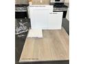 Close up on Elkins White upgraded cabinets, Simply White quartz and Toasted Taupe flooring at 10026 Indy Rey Ct, Las Vegas, NV 89148
