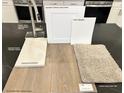 Close up on Elkins White upgraded cabinets, Calcatta Patriotic quartz and Toasted Taupe flooring at 10026 Indy Rey Ct, Las Vegas, NV 89148