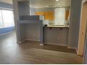 Open-concept space showcasing kitchen with a breakfast bar at 15 E Agate Ave # 202, Las Vegas, NV 89123