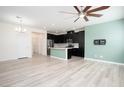 Spacious living area with view of eat-in kitchen, with island, and modern appliances at 25 Barbara Ln # 57, Las Vegas, NV 89183