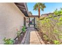 Inviting front entryway with decorative details, a charming window, and desert landscaping at 2583 Egret Cir, Las Vegas, NV 89121