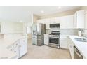 Well-lit kitchen showcasing stainless steel appliances and ample counter space at 2605 Memphis Ave, Henderson, NV 89052