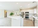 Bright, open kitchen featuring stainless steel appliances and a large island at 2605 Memphis Ave, Henderson, NV 89052