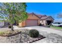 Charming single-Gathering home featuring a two-car garage and low maintenance desert landscaping at 3193 Emerald Creek Dr, Las Vegas, NV 89156