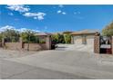 Inviting home with a long driveway, gated entrance, and tandem two-car garages at 3518 W Agate Ave, Las Vegas, NV 89139