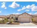 Inviting single-story house featuring well-maintained landscaping and a two-car garage at 4416 Peaceful Morning Ln, Las Vegas, NV 89129