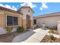 Inviting home featuring a decorative water fountain and walkway leading to the entrance at 4416 Peaceful Morning Ln, Las Vegas, NV 89129
