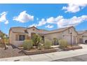Attractive single-story home with manicured desert landscaping and a welcoming entrance at 4416 Peaceful Morning Ln, Las Vegas, NV 89129