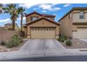 Charming two-story home with a two-car garage and desert landscaping at 651 Penshaw Bridge Ave, Las Vegas, NV 89178