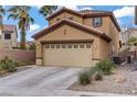Charming two-story home with an attached two-car garage and well-maintained landscaping at 651 Penshaw Bridge Ave, Las Vegas, NV 89178