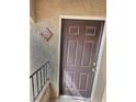 Close-up of the brown front door, unit 2153, with a bronze colored door knob at 7885 W Flamingo Rd # 2153, Las Vegas, NV 89147