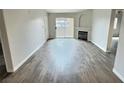 Bright living room featuring a fireplace and access to the patio at 7885 W Flamingo Rd # 2153, Las Vegas, NV 89147
