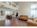 Bright living room with hardwood floors, high ceilings, and natural light at 7905 Coral Point Ave, Las Vegas, NV 89128