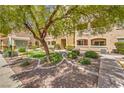 Well-maintained condo grounds with mature shade tree, shrubs, ground cover and lush landscaping at 8777 W Maule Ave # 3102, Las Vegas, NV 89148
