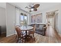 Cozy breakfast nook features a round table, a ceiling fan, and a sliding glass door to the outside at 9121 Ripple Ridge Ave # 101, Las Vegas, NV 89149