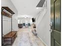 Welcoming entryway with decorative bench and view of the living space at 9144 Irish Elk Ave, Las Vegas, NV 89149