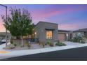 Charming modern home with well-maintained landscaping and a two-car garage at 9889 Gemstone Sunset Ave, Las Vegas, NV 89148